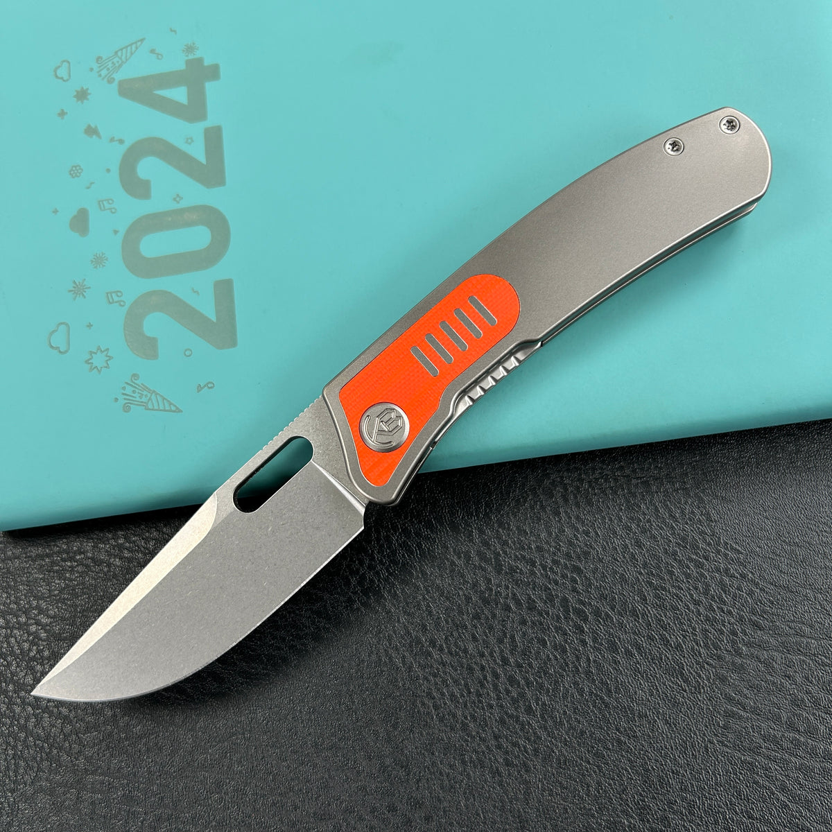 KB Knives  KB377A Common  Thread Frame Lock Folding Knife Grey Titanium with Orange G10 Inlays 2.95'' M390 Blade