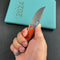 KB Knives  KB377A Common  Thread Frame Lock Folding Knife Grey Titanium with Orange G10 Inlays 2.95'' M390 Blade