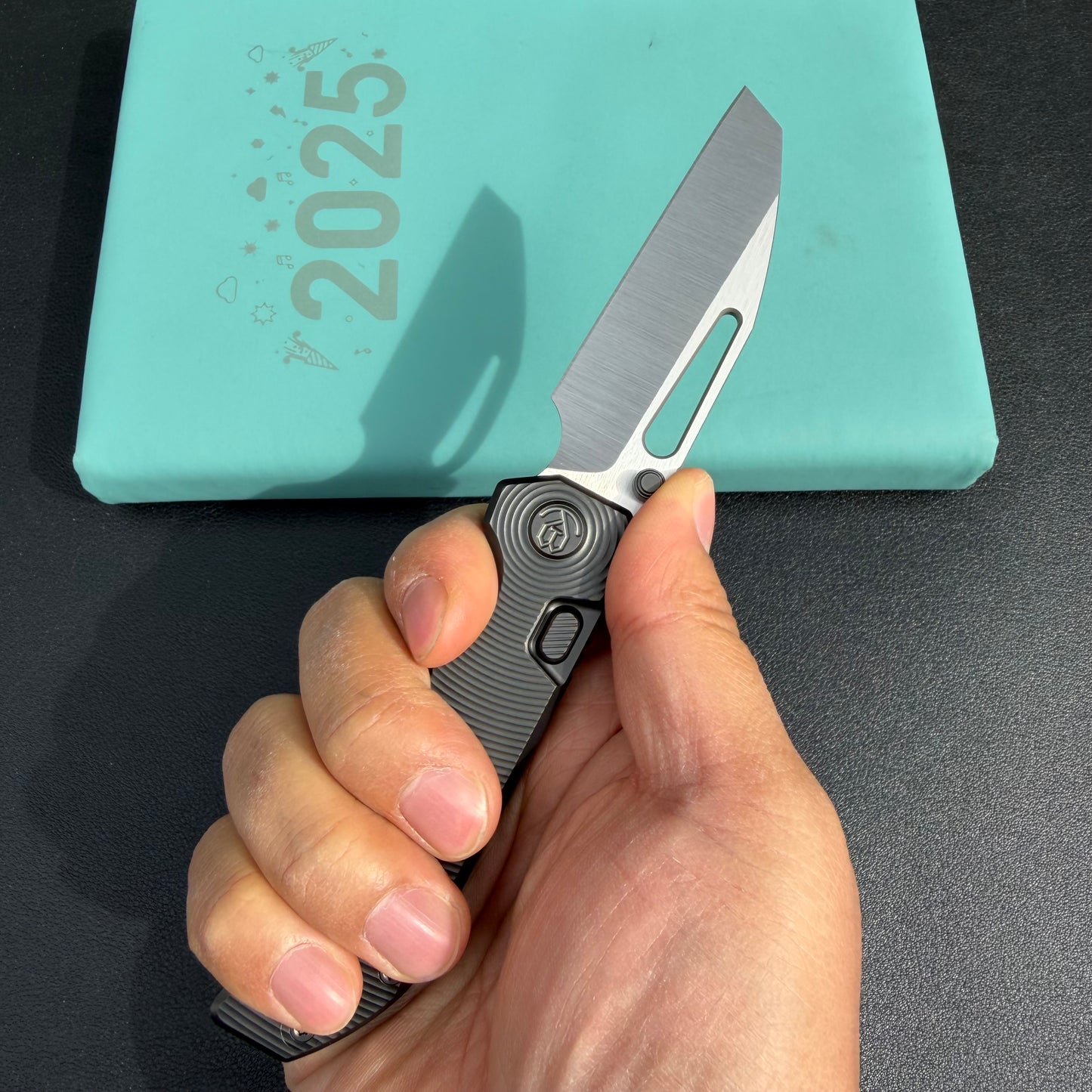 KB Venom KB435C Top Liner Lock Pocket Folding Knife Flame Ano Titanium w/ Radial Milling 3.46" Belt Satin CPM S90V Blade  Check out the  KB435B  here:  https://knifeglobal.com/search?q=kb435&options%5Bprefix%5D=last&type=product