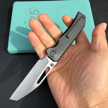 KB Venom KB435C Top Liner Lock Pocket Folding Knife Flame Ano Titanium w/ Radial Milling 3.46" Belt Satin CPM S90V Blade  Check out the  KB435B  here:  https://knifeglobal.com/search?q=kb435&options%5Bprefix%5D=last&type=product