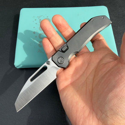 KB Venom KB435C Top Liner Lock Pocket Folding Knife Flame Ano Titanium w/ Radial Milling 3.46" Belt Satin CPM S90V Blade  Check out the  KB435B  here:  https://knifeglobal.com/search?q=kb435&options%5Bprefix%5D=last&type=product