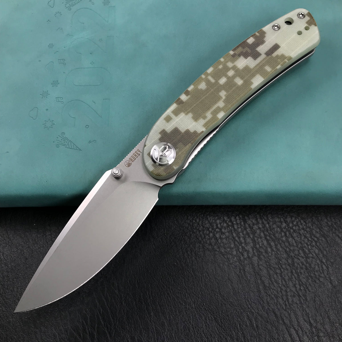 KUBEY KU344K Momentum Sherif Manganas Design Liner Lock Front Flipper / Dual Studs Open Folding Knife Digtal Camo G10 Handle 3.43" Bead Blasted AUS-10