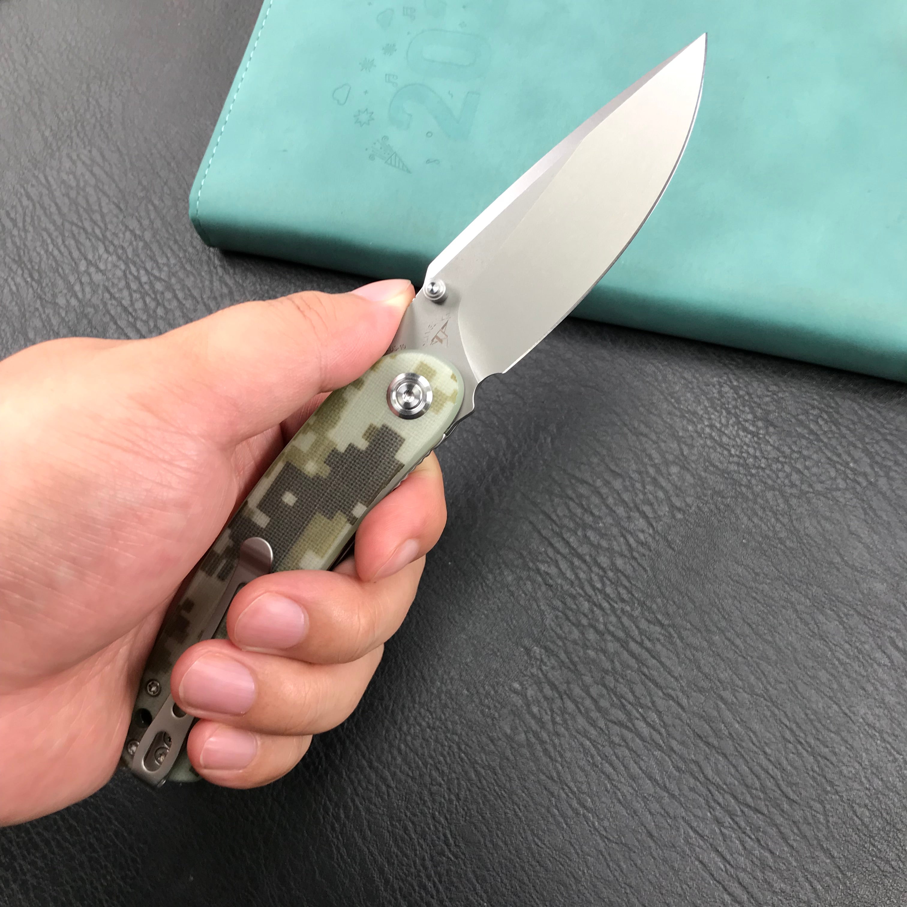 KUBEY KU344K Momentum Sherif Manganas Design Liner Lock Front Flipper / Dual Studs Open Folding Knife Digtal Camo G10 Handle 3.43" Bead Blasted AUS-10