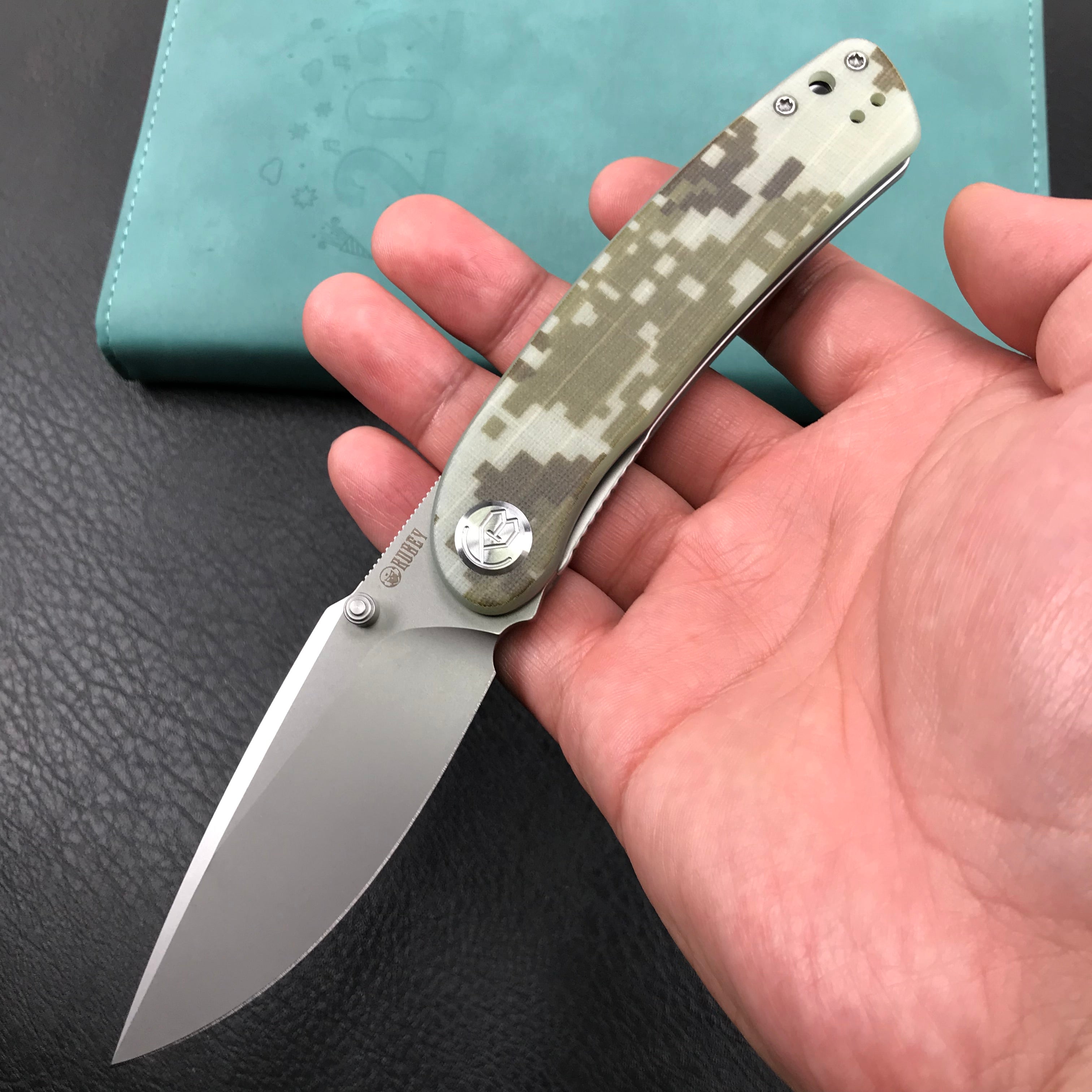 KUBEY KU344K Momentum Sherif Manganas Design Liner Lock Front Flipper / Dual Studs Open Folding Knife Digtal Camo G10 Handle 3.43" Bead Blasted AUS-10