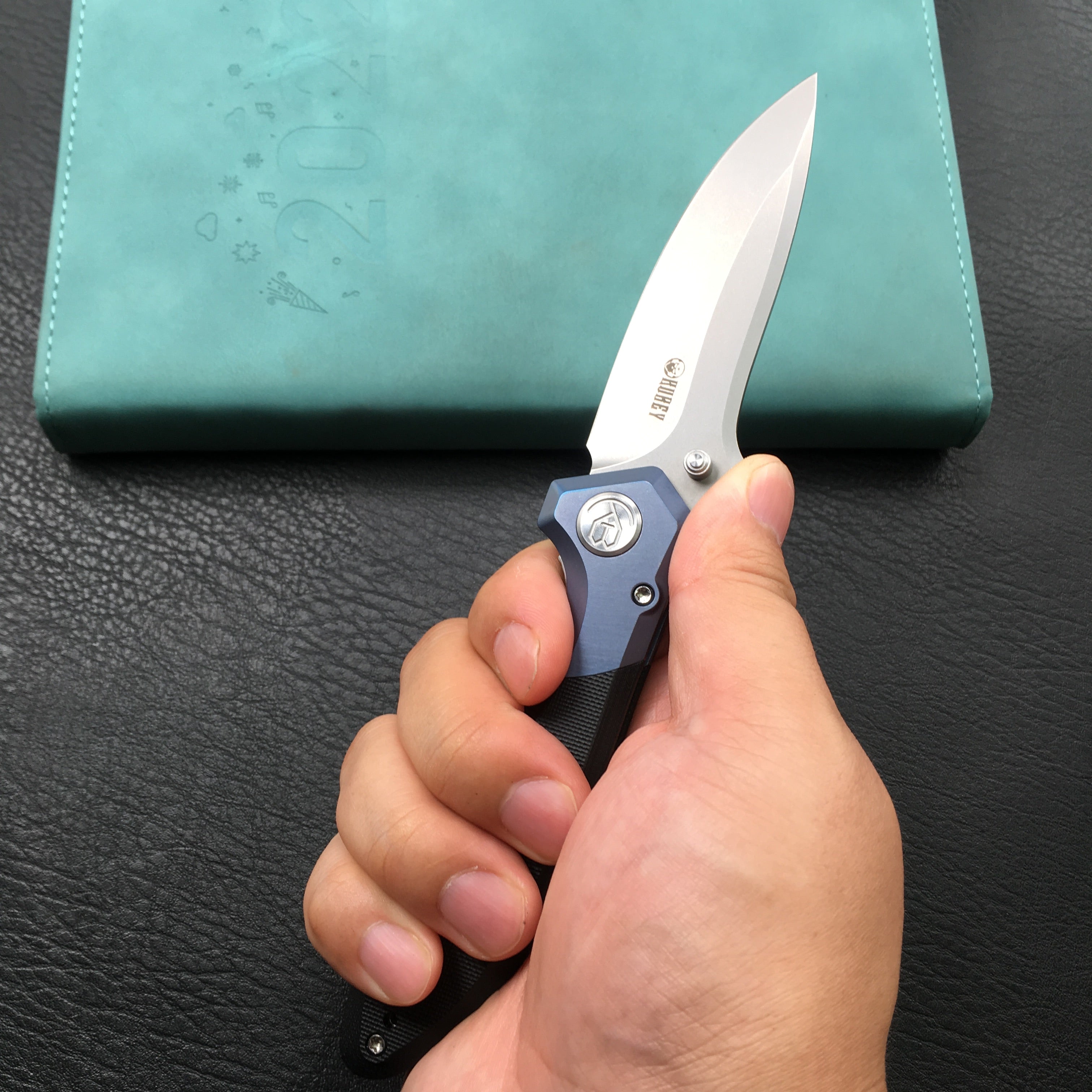 KUBEY KU314A Ruckus Liner Lock Folding Knife Blue Titanium Head and Black G10 Handle 3.31" Blasted Stonewashed AUS-10