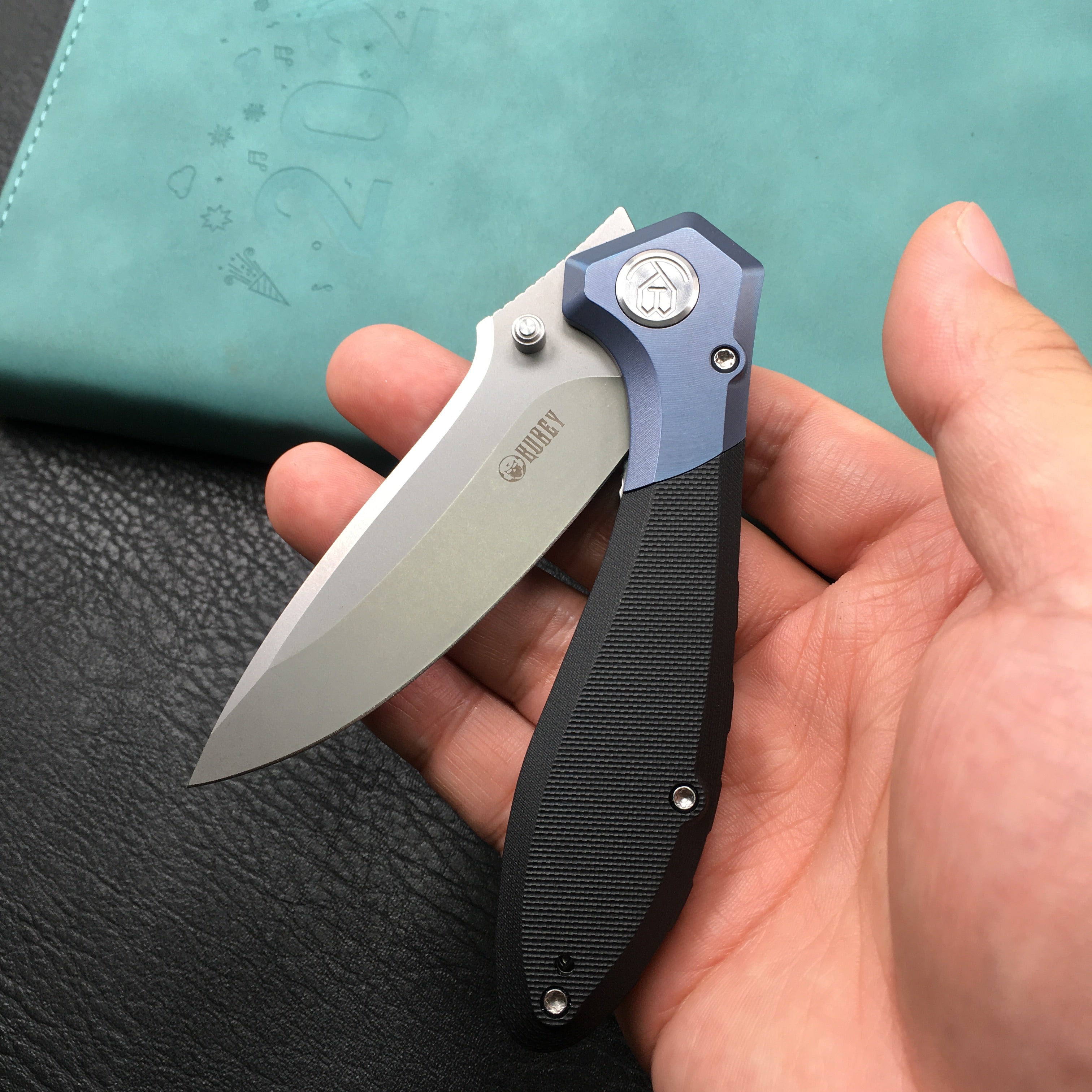 KUBEY KU314A Ruckus Liner Lock Folding Knife Blue Titanium Head and Black G10 Handle 3.31" Blasted Stonewashed AUS-10