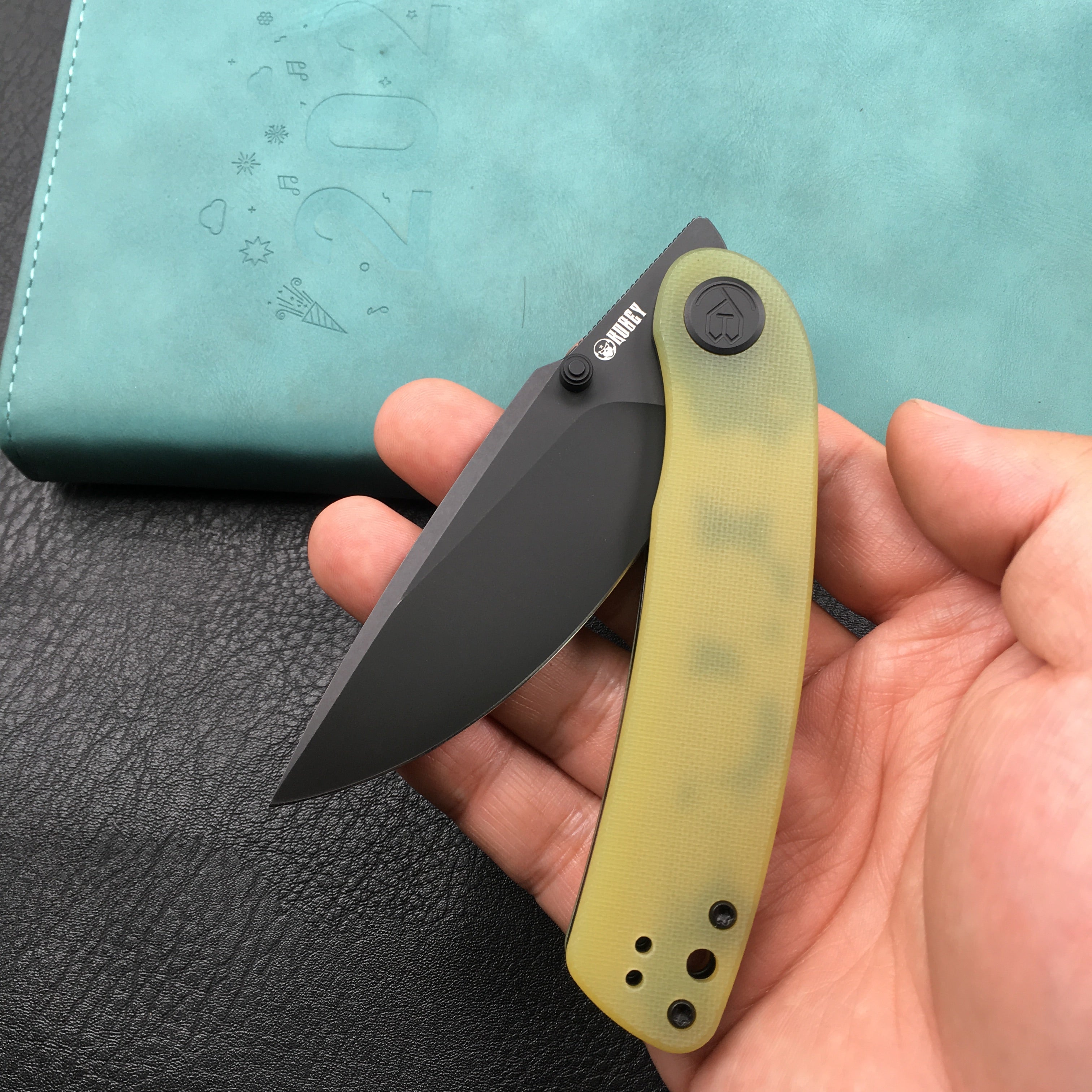 KUBEY KU344F Momentum Sherif Manganas Design Liner Lock Front Flipper / Dual Studs Open Folding Knife Translucent Yellow G10 Handle 3.43" Dark Stonewashed AUS-10