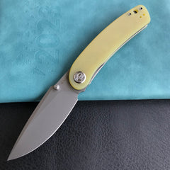 KUBEY KU344 Momentum Sherif Manganas Design Liner Lock Front Flipper / Dual Studs Open Folding Knife Translucent Yellow  G10 Handle 3.43" Bead Blasted AUS-10