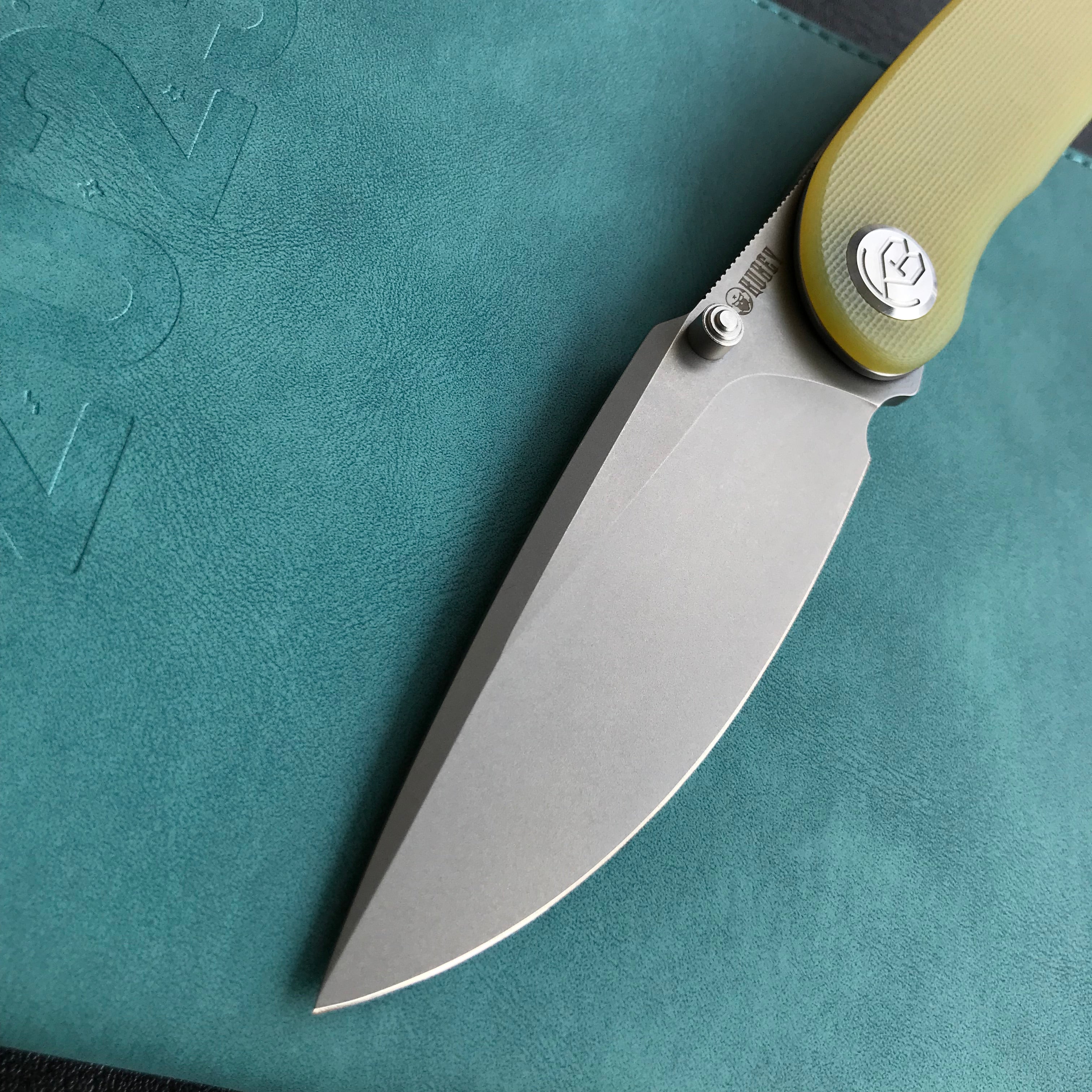 KUBEY KU344 Momentum Sherif Manganas Design Liner Lock Front Flipper / Dual Studs Open Folding Knife Translucent Yellow  G10 Handle 3.43" Bead Blasted AUS-10