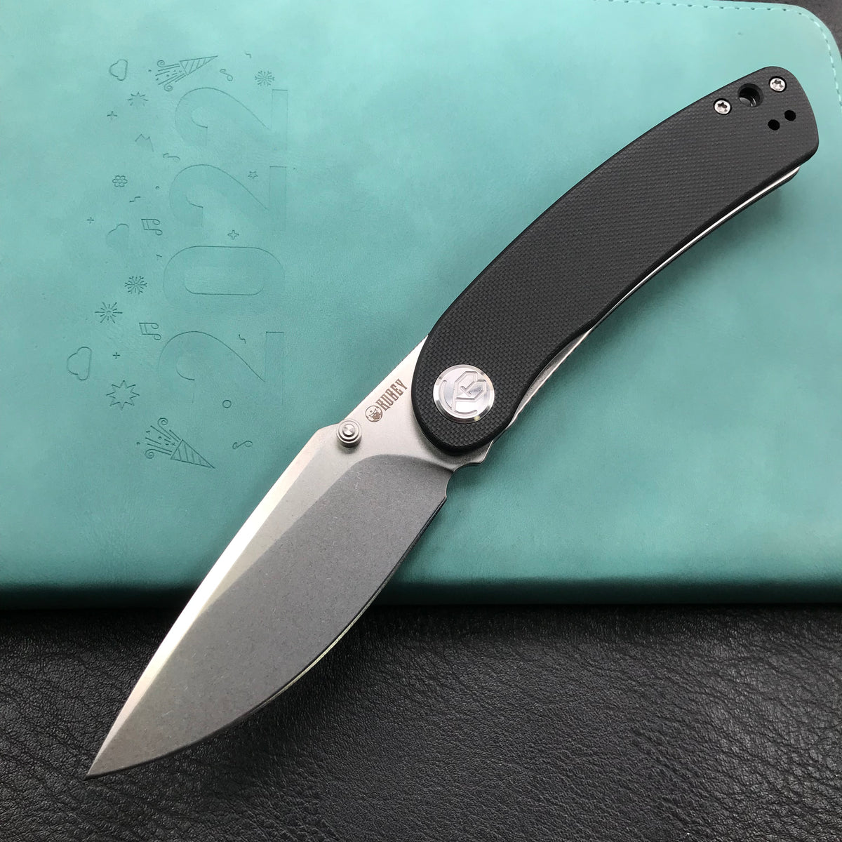 KUBEY  KU344A Momentum Sherif Manganas Design Liner Lock Front Flipper  Dual Studs Open Folding Knife Black G10 Handle 3.43" Blasted Stonewashed D2