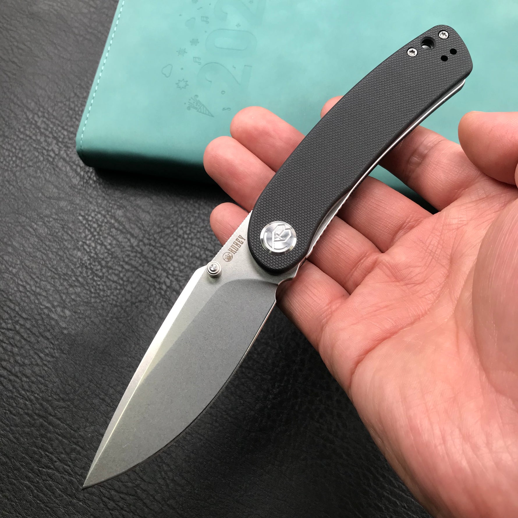 KUBEY  KU344A Momentum Sherif Manganas Design Liner Lock Front Flipper  Dual Studs Open Folding Knife Black G10 Handle 3.43" Blasted Stonewashed D2